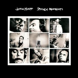 Album cover for 'Stolen Moments' album featuring the song 'Back Of My Mind' by John Hiatt – Learn to play on guitar.