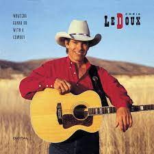 Album cover for 'Whatcha Gonna Do With A Cowboy' album featuring the song 'Call Of The Wild' by Chris Ledoux – Learn to play on guitar.