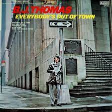 Album cover for 'Everybody's Out Of Town' album featuring the song 'I Just Can't Help Believing' by BJ Thomas – Learn to play on guitar.