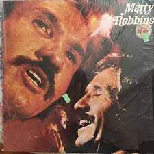 Album cover for 'Marty Robbins' album featuring the song 'Love Me' by Marty Robbins – Learn to play on guitar.