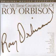 Album cover for 'The All Time Greatest Hits' album featuring the song 'Mean Woman Blues' by Roy Orbison – Learn to play on guitar.