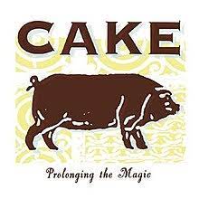 Learn to play 'Never There' by Cake – Chords & Lesson. Album cover for 'Prolonging The Magic' album featuring the song 'Never There' by Cake – Learn to play on guitar.