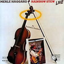Album cover for 'Rainbow Stew Live From Anaheim Stadium' album featuring the song 'Rainbow Stew' by Merle Haggard – Learn to play on guitar.