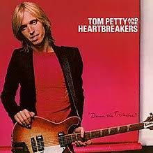Learn to play 'Refugee' by Tom Petty – Chords & Lesson. Album cover for 'Damn The Torpedos' album featuring the song 'Refugee' by Tom Petty – Learn to play on guitar.