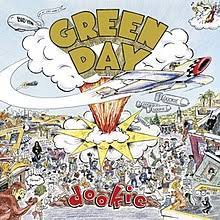 Learn to play 'She' by Green Day – Chords & Lesson. Album cover for 'Dookie' album featuring the song 'She' by Green Day – Learn to play on guitar.