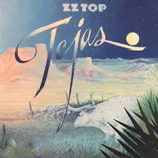 Album cover for 'Tejas' album featuring the song 'She's A Heartbreaker' by ZZ Top – Learn to play on guitar.