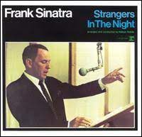 Album cover of Strangers In The Night featuring songs by Frank Sinatra and the song Strangers In The Night Album cover of Strangers In The Night featuring songs by Frank Sinatra and the song Strangers In The Night
