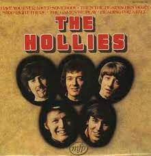 Album cover for 'The Hollies' album featuring the song 'The Air That I Breathe' by The Hollies – Learn to play on guitar.