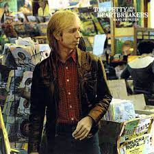 Learn to play 'The Waiting' by Tom Petty – Chords & Lesson. Album cover for 'Hard Promises' album featuring the song 'The Waiting' by Tom Petty – Learn to play on guitar.