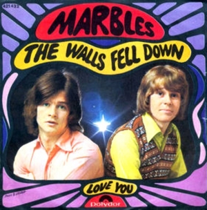 Learn to play 'The Walls Fell Down' by The Marbles – Chords & Lesson. Album cover for 'Love You' album featuring the song 'The Walls Fell Down' by The Marbles – Learn to play on guitar.