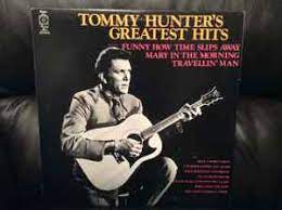 Album cover of Tommy Hunter Greatest Hits featuring 50s and 60s country songs and the song Traveling Man Album cover of Tommy Hunter Greatest Hits featuring 50s and 60s country songs and the song Traveling Man
