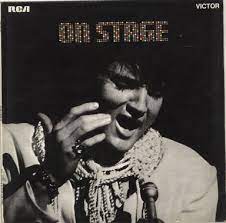 Album cover of On Stage featuring Elvis songs in the 70s and the song Walk A Mile In My Shoes Album cover of On Stage featuring Elvis songs in the 70s and the song Walk A Mile In My Shoes