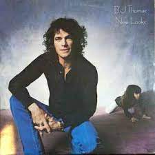 Album cover for 'New Looks' album featuring the song 'Whatever Happened To Old Fashioned Love' by BJ Thomas – Learn to play on guitar.