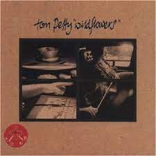 Learn to play 'Wildflowers' by Tom Petty – Chords & Lesson. Album cover for 'Wildflowers' album featuring the song 'Wildflowers' by Tom Petty – Learn to play on guitar.